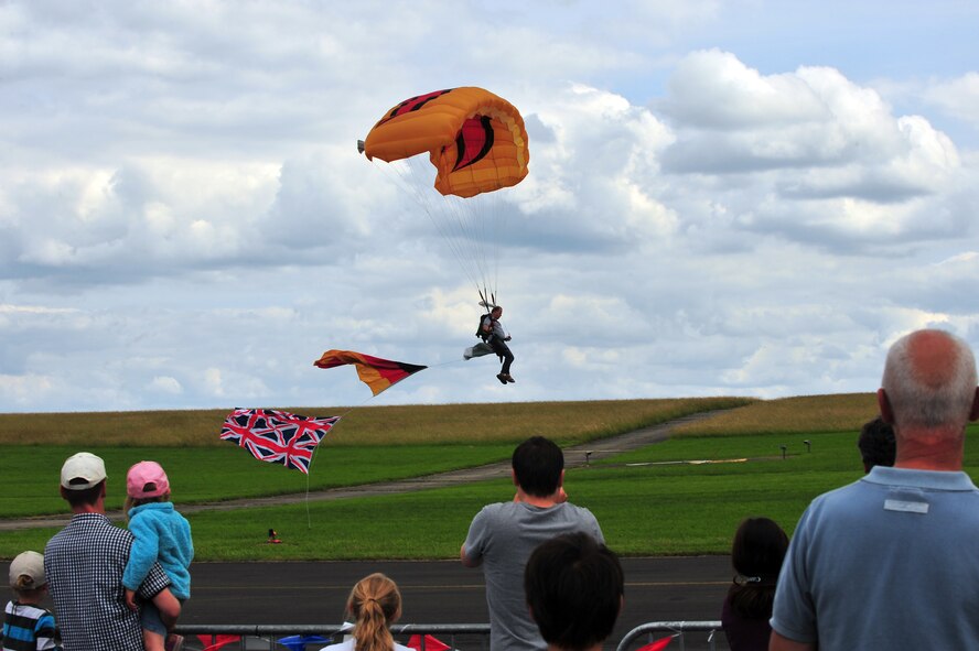 BITBURG, Germany – A member of the Firebird Paragliding team prepares for landing after a demonstration of aerial maneuvers at the Aviation Expo Europe here June 23. The annual expo features multiple aerial demonstrations and an aircraft sales and showcase floor. More than 5,000 exhibitors, vendors and visitors attended the three-day event. This year’s expo included its first showcase of an A-10 aircraft at the new location at the Bitburg Airport. (U.S. Air Force photo by Airman 1st Class Dillon Davis/Released)