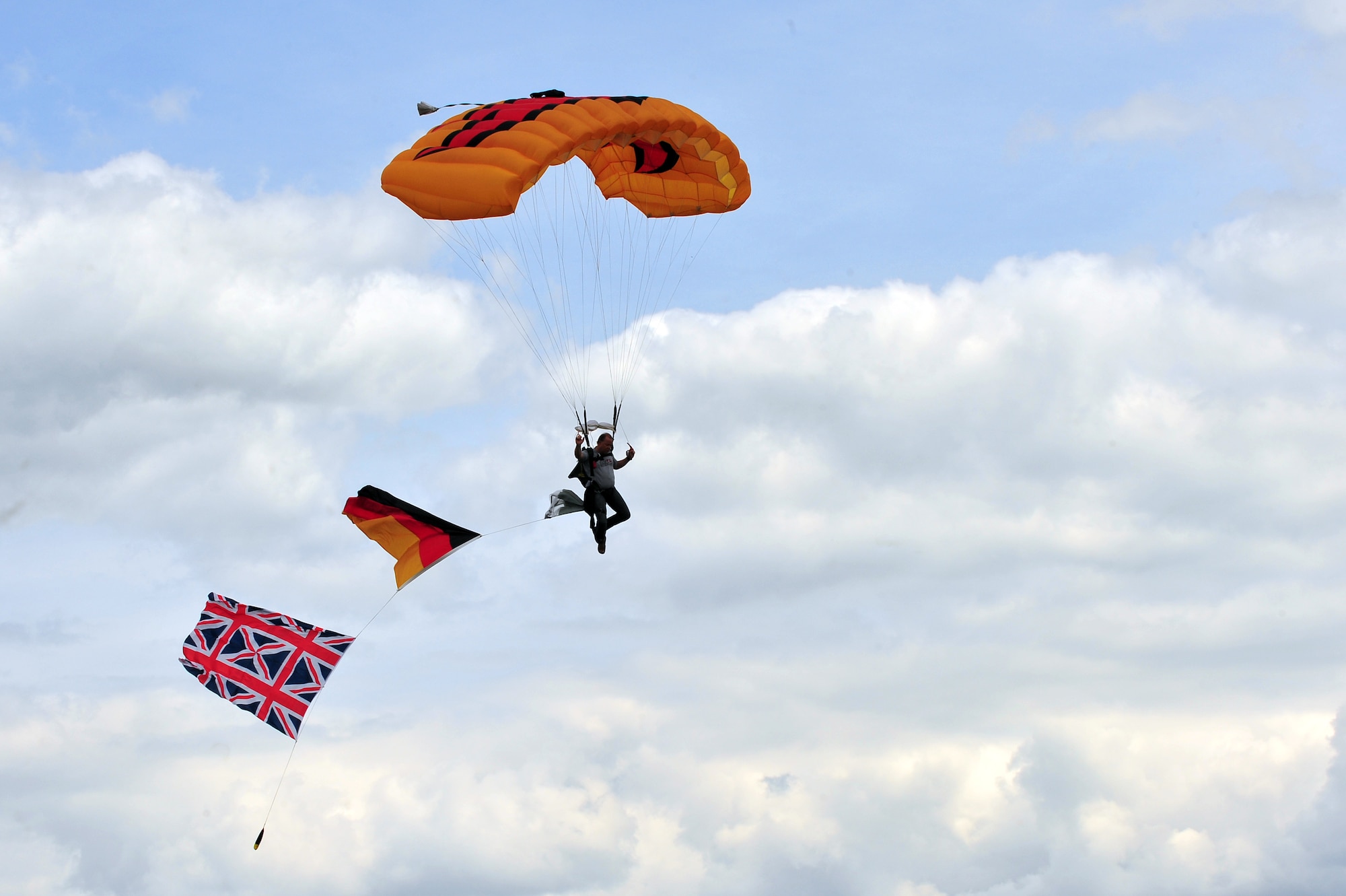 BITBURG, Germany – A member of the Firebird Paragliding team performs aerial maneuvers during Aviation Expo Europe here June 23. The annual expo features multiple aerial demonstrations and an aircraft sales and showcase floor. More than 5,000 exhibitors, vendors and visitors attended the three-day event. This year’s expo included its first showcase of an A-10 aircraft at the new location at the Bitburg Airport. (U.S. Air Force photo by Airman 1st Class Dillon Davis/Released)