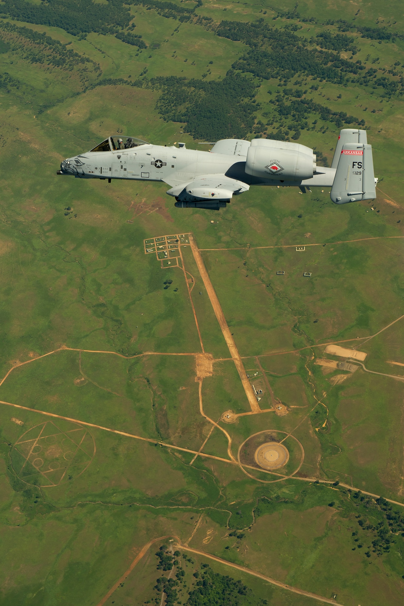 Lt. Col. Brian Burger, an A-10C Thunderbolt II pilot and the 188th Fighter Wing Operations Group commander, prepares to attack a target during a training exercise on Razorback Range located at Fort Chaffee Maneuver Training Center, Ark., June 4, 2012. The 188th, nearing its second deployment to Afghanistan with the A-10, regularly conducts training with Joint Terminal Attack Controllers (JTAC) from different branches of service to sharpen its close air support skills and to conduct efficient training with JTACs. During this exercise, JTACs from the 75th Ranger Regiment provided forward control. (U.S. Air Force photo by Master Sgt. Ben Bloker) 
