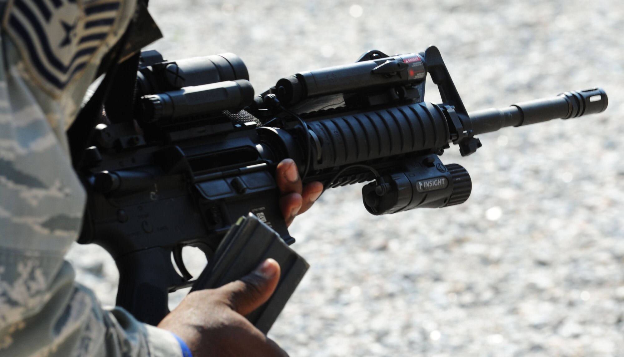 A 633rd Security Forces Squadron Airman clears a jam and prepares to reload at Fort Eustis, Va., June 21, 2012. Earlier in their training, participants were presented multiple examples of weapon jams and required to clear them. (U.S. Air Force photo by Airman 1st Class Austin Harvill/Released)