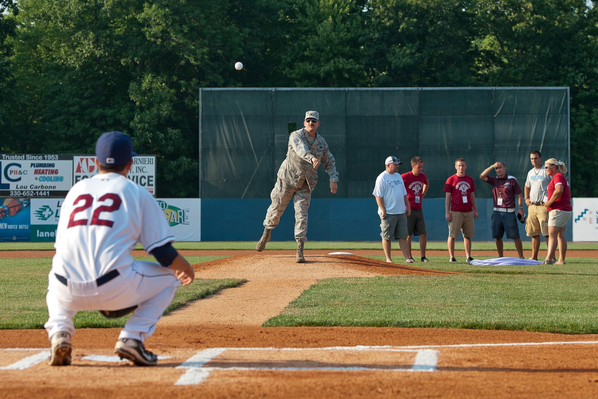 Col. Reinhard Schmidt, commander of the 910th Airlift Wing, throws out the first pitch to begin the home opener of the Mahoning Valley Scrappers baseball team Wednesday, June 20, 2012.  To celebrate the home opener and the Scrappers’ military appreciation night, the base color guard presented the colors during the Anthem, and a 910th Airlift Wing C-130H Hercules aircraft performed a low-level flyover. Air Force recruiters from YARS set up a display table on the concourse and made their presence known by parading Airman Andy, a large inflatable mascot, through the stands to greet fans. As fans entered the stadium, they were able to view a Humvee from the Marine Corps Reserve Landing Support Equipment Company, Youngstown.