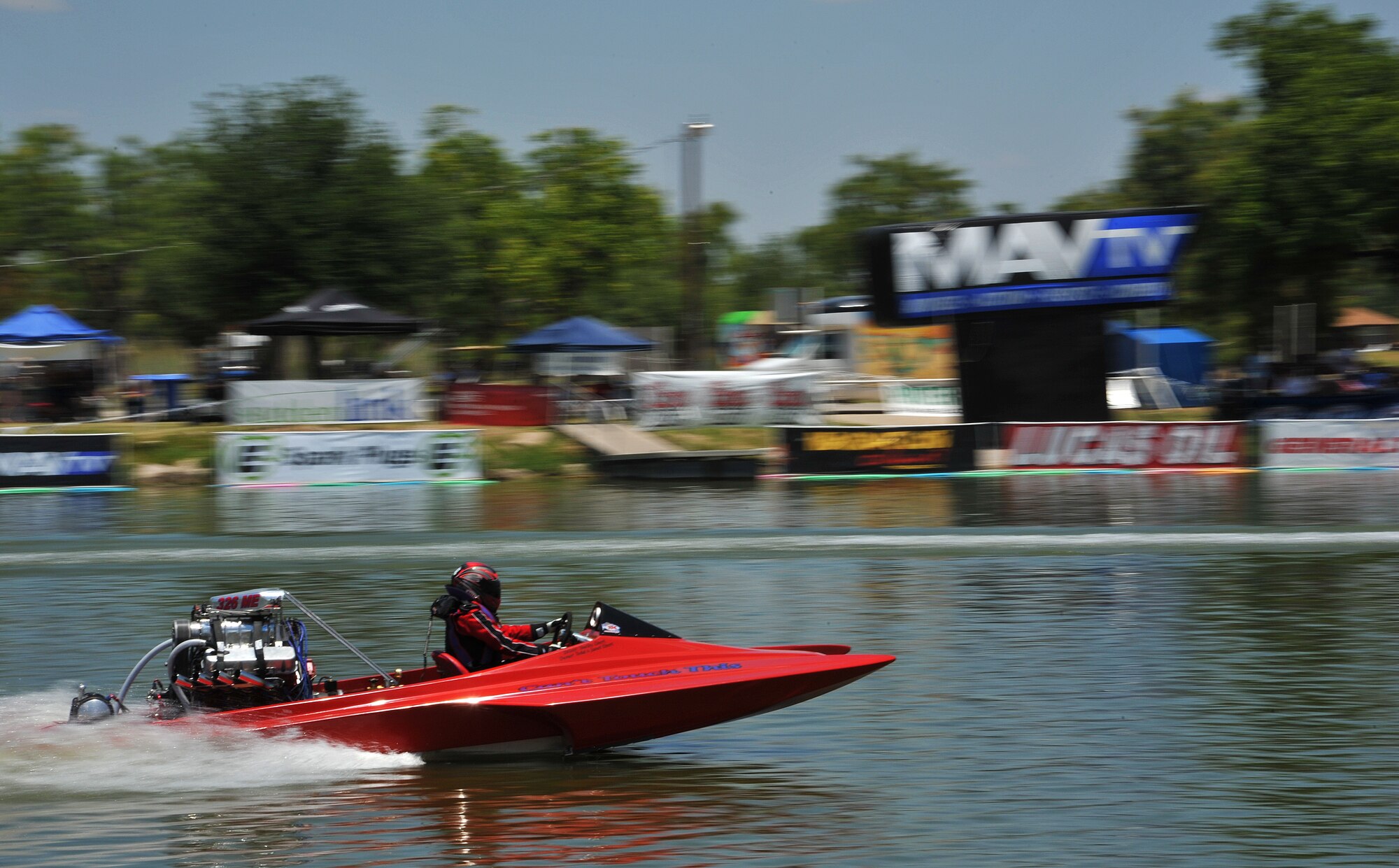 SAN ANGELO, Texas-- Shelby Ebert, driver of “Can’t Touch This”, speeds through the water during the Sixth Annual San Angelo Showdown drag boat races at Lake Nasworthy, June 23.  Each boat can reach speeds over 100mph and are propelled by high performance engines. (U.S. Air Force photo/Airman 1st Class Michael Smith)