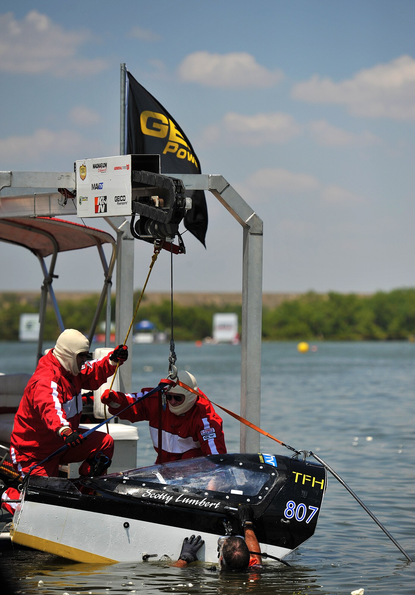 SAN ANGELO, Texas-- Scotty Lumbert, driver of the MAVTV boat, gets lifted out of the water while in his pod during the Sixth Annual San Angelo Showdown drag boat races at Lake Nasworthy, June 23.  Lumbert’s boat crashed halfway through the race sending him to the hospital with only minor injuries. (U.S. Air Force photo/Airman 1st Class Michael Smith)