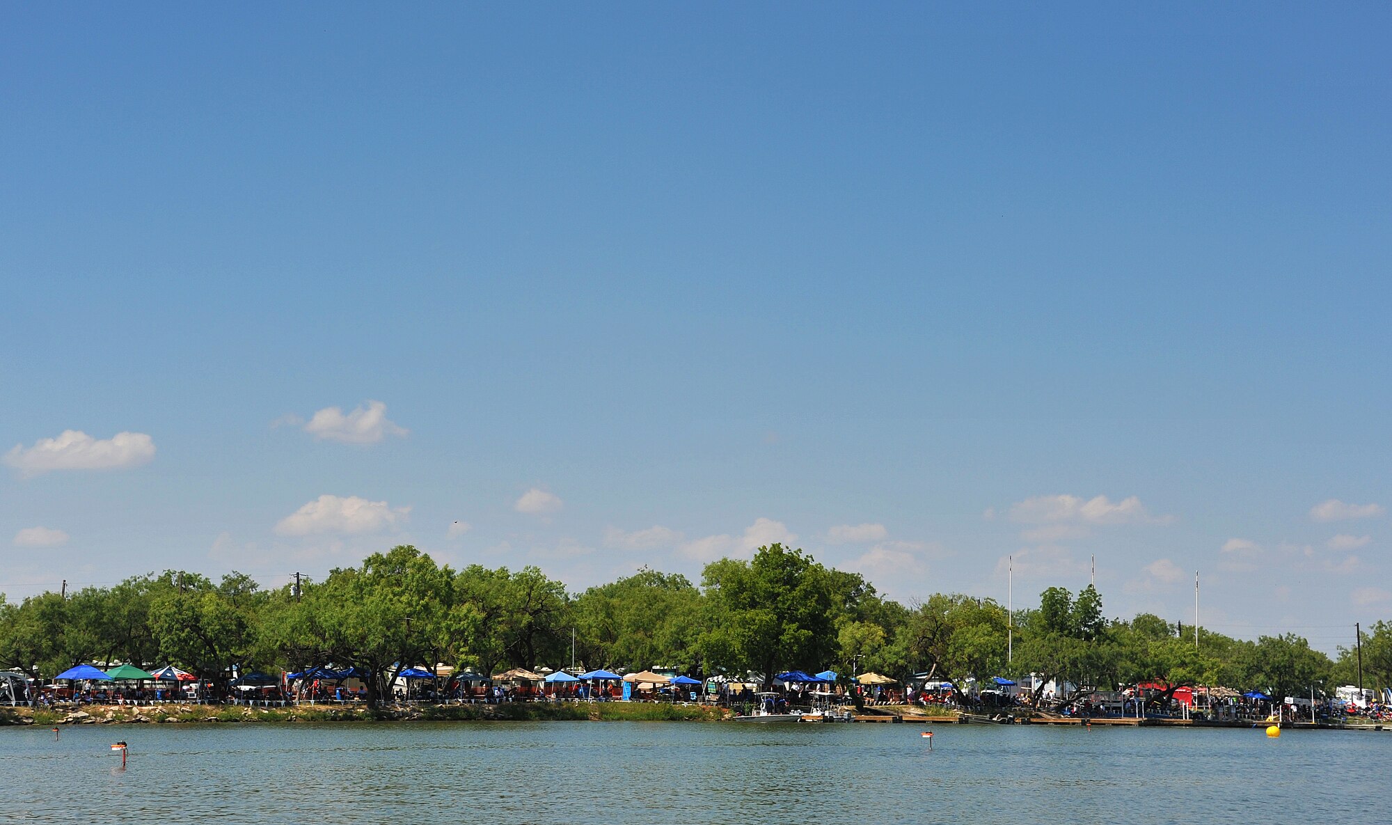 SAN ANGELO, Texas-- Onlookers wait for the start of the next boat race during the Sixth Annual San Angelo Showdown drag boat races at Lake Nasworthy, June 23.  Thousands of fans came to the lake to watch the drag boats speed by. (U.S. Air Force photo/Airman 1st Class Michael Smith)