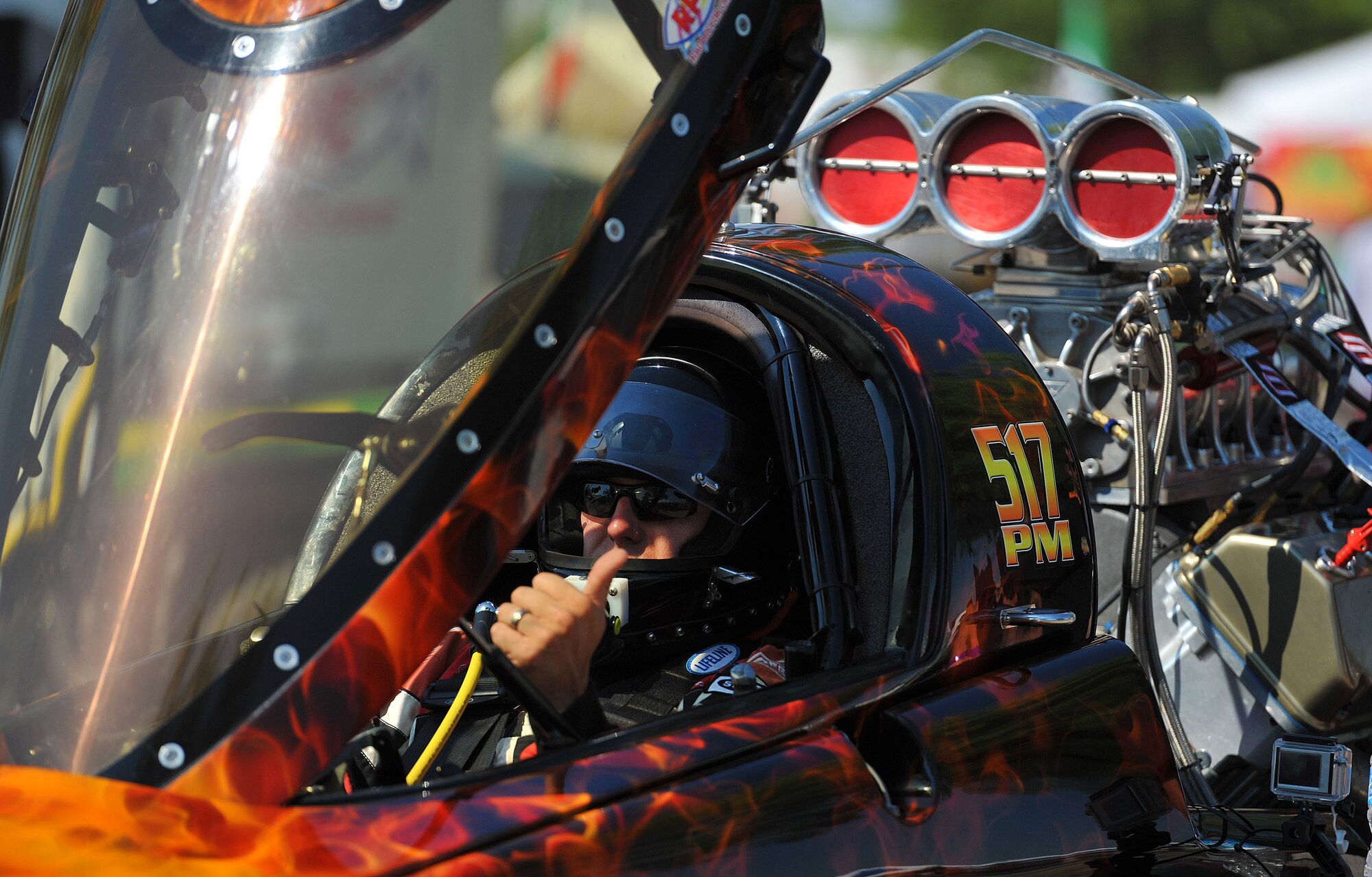 SAN ANGELO, Texas-- Shannon Beale, driver of “Split Decision Two”, poses for a photo while in his boat during the Sixth Annual San Angelo Showdown drag boat races at Lake Nasworthy, June 23.  Racers wear up to 30 pounds of gear to help protect them in the case of crashes or fires. (U.S. Air Force photo/Airman 1st Class Michael Smith)