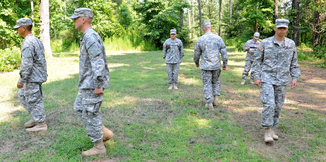 Four Soldiers perform a “Counter-Column” drill movement at the direction of U.S. Army Staff. Sgt. Cesar Ruiz, Fort Benning, Ga., drill instructor, June 25, 2012, during the annual Drill Instructor of the Year competition, held at Fort Eustis, Va. During the weeklong competition six drill instructors compete in various events to determine who wins the title. (U.S. Air Force photo by Senior Airman Wesley Farnsworth/Released)