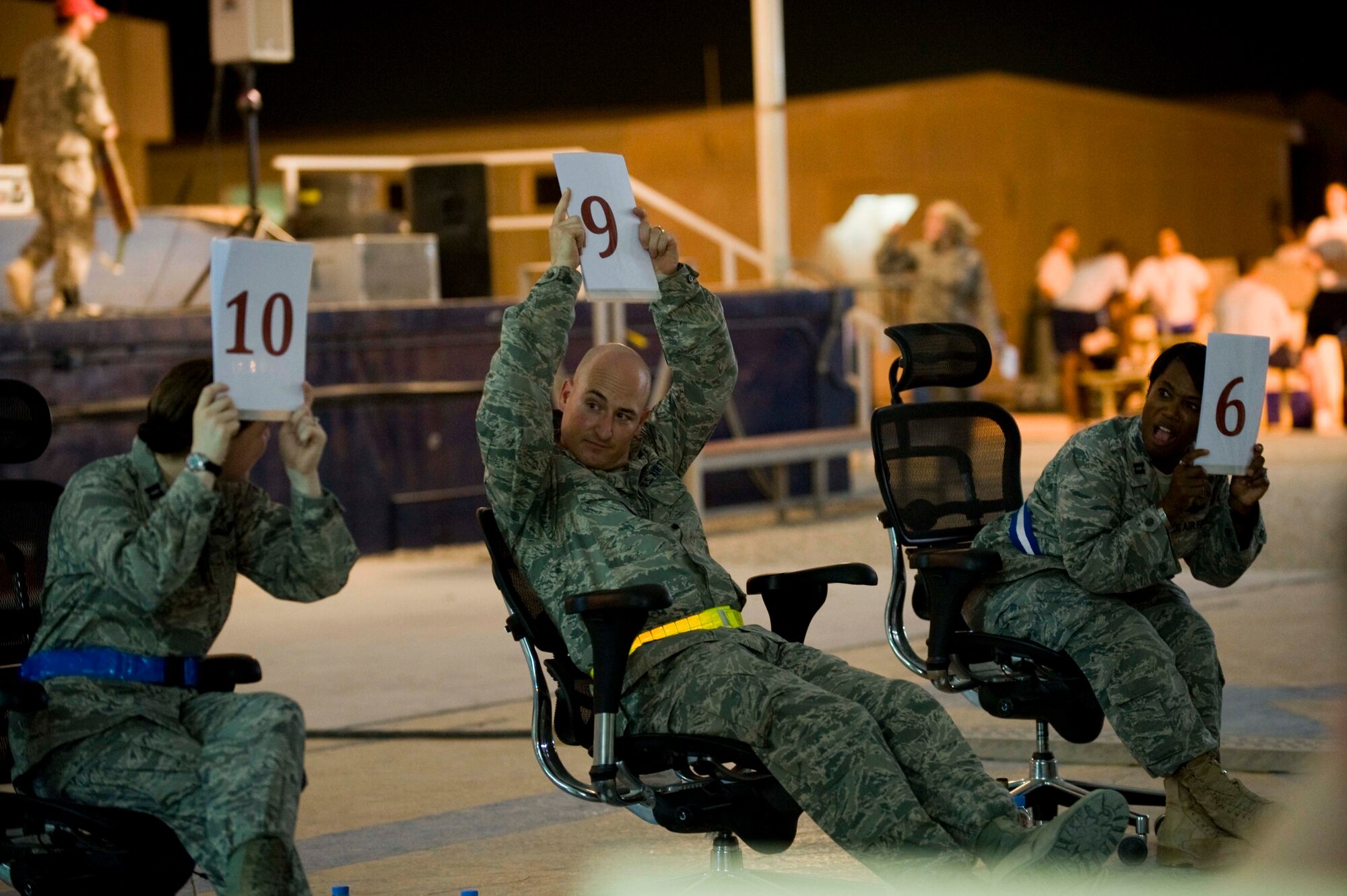 'The Voice' judges compared scores after a performance by U.S. Army Specialist Joshua McGonigle for the 379th Air Expeditionary Wing 'The Voice' competition in Southwest Asia, June 23, 2012. (U.S. Air Force photo/Staff Sgt. Sheila deVera)