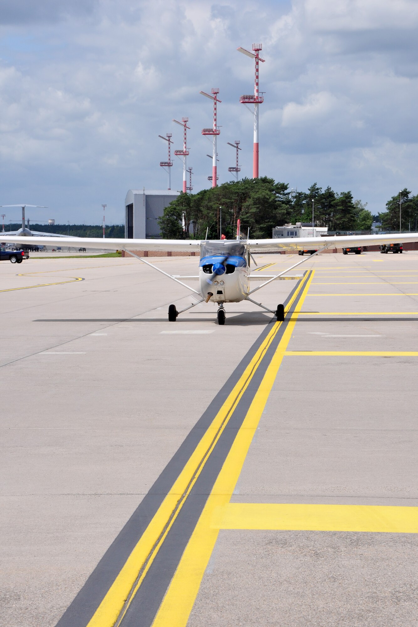 A Cessna 172 piloted by Lt. Col. Rich Radvanyi, president of the Coleman Aero Club, and co-piloted by Airman 1st Class Nicholas Fennen, 86th Airlift Wing Judge Advocate discharge paralegal, pulls away from the Ramstein Air Base, Germany DV Lounge June 22, 2012. The flight was part of the Ramstein Daedalians Aviation Incentive Flight program, which provides quarterly aviation incentive flights to deserving young Airmen and gives them the chance to live a childhood fantasy of flight. (U.S. Air Force photo/Tech. Sgt. Chad Thompson)