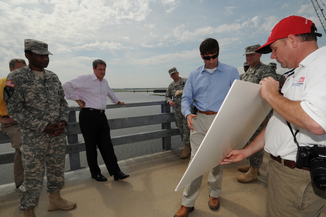 LOUISIANA — Lt. Gen. Thomas Bostick, Commanding General of the U.S. Army Corps of Engineers, signed the "Louisiana Coastal Area Barataria Basin Barrier Shoreline Restoration" report June 22, 2012 on top of the Inner Harbor Navigation Canal Surge Barrier. Col. Edward Fleming, U.S. Army Corps of Engineers New Orleans District commander, highlighted the united front federal, state and local agencies are taking in support of the Hurricane and Storm Damage Risk Reduction System building built here. The HSDRRS system is referred to as the best the area has ever had regarding storm risk reduction. On hand for the ceremony was U.S. Sen. David Vitter. 