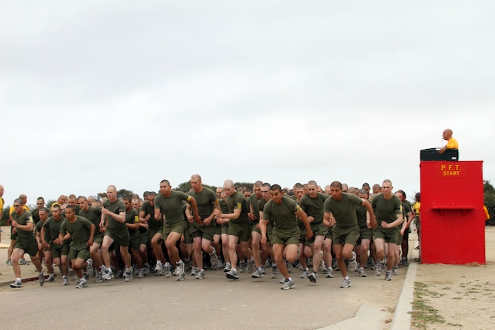 Recruits of Company H, 2nd Recruit Training Battalion, start the three-mile run portion of their final physical fitness test June 14 aboard Marine Corps Recruit Depot San Diego. The PFT is comprised of a max set of pull ups, a timed three-mile run and a max set of crunches in two minutes. The Company H recruits completed pull-ups and will complete the last portion of the test after the run with crunches to finish their final PFT.