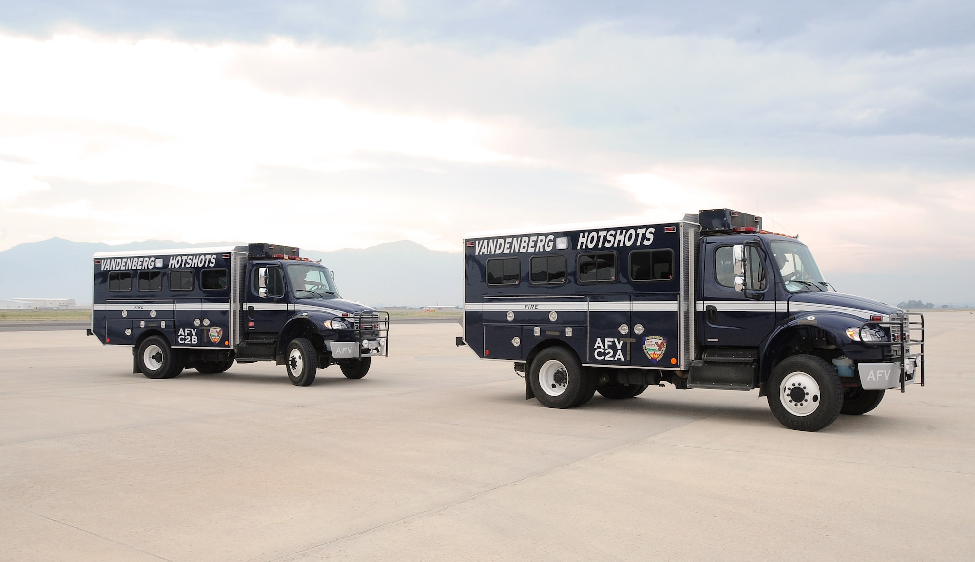 Two specialized vehicles arrive with Vandenberg's 18-member Hot Shots wildland fire fighting team. The Hot Shot firefighting crew is specially trained and equipped to prevent and suppress wildfires. They are the only specialized DoD wildland fire fighting team of their kind and are in Colorado Springs supporting Waldo Canyon Fire suppression efforts. (U.S. Air Force Photo/Duncan Wood)