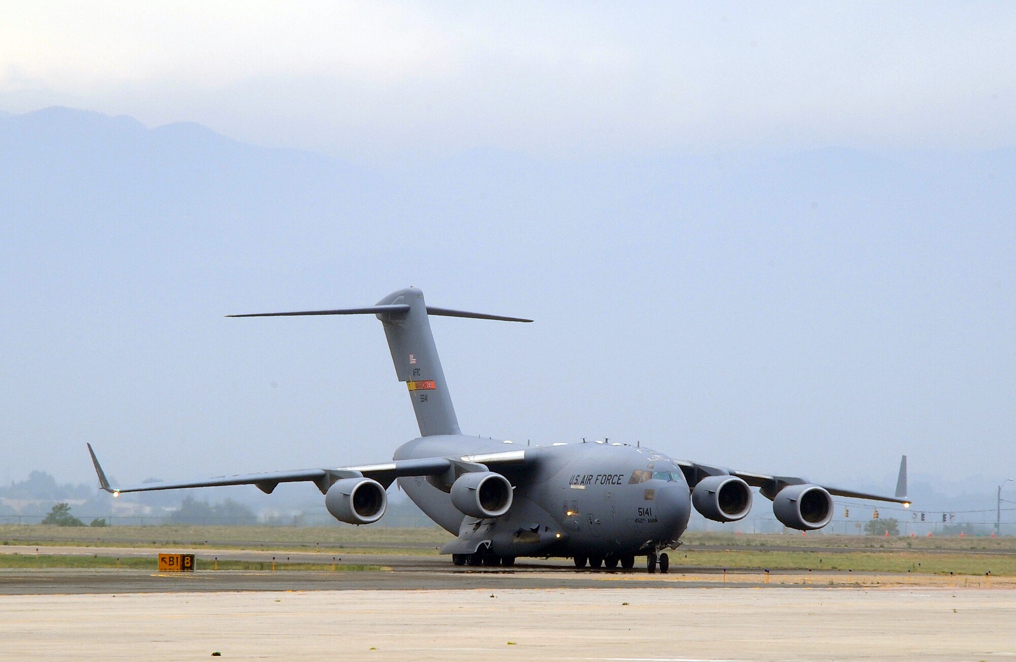 A C-17 Globemaster III from March Air Reserve Base, Calif., arrives at Peterson Air Force Base, Colo., June 27 carrying members of the Vandenberg Air Force Base, Calif., Hot Shots specialized fire fighting team. The specialized team, the only of its kind in DoD, is in Colorado Springs helping the Waldo Canyon Fire suppression efforts. (U.S. Air Force Photo/Duncan Wood)