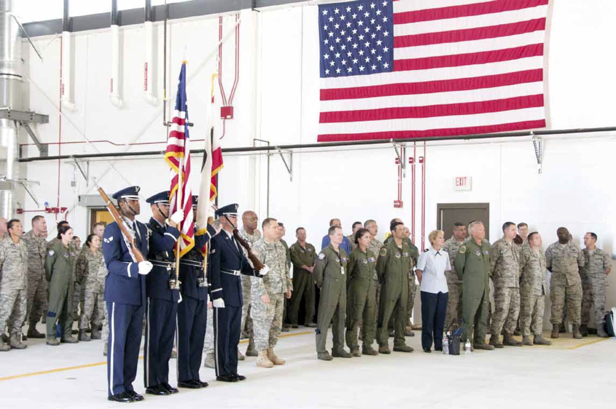 Senior Airman Jaron Buchanan, left, Staff Sgt. Daniel Stephens, Staff Sgt. John Zimmerman, and Senior Airman Michael Antonson of the Blue Eagle’s Total Force Honor Guard, perform during the 163d Reconnaissance Wing’s new hangar ribbon
cutting ceremony at the Southern California Logistics Airport in Victorville, Calif., June 15, 2012. The 163d RW celebrated the official opening of the MQ-1 Predator hangar with several community members in attendance. (Air National Guard Photo by Master Sgt. Julie Avey)