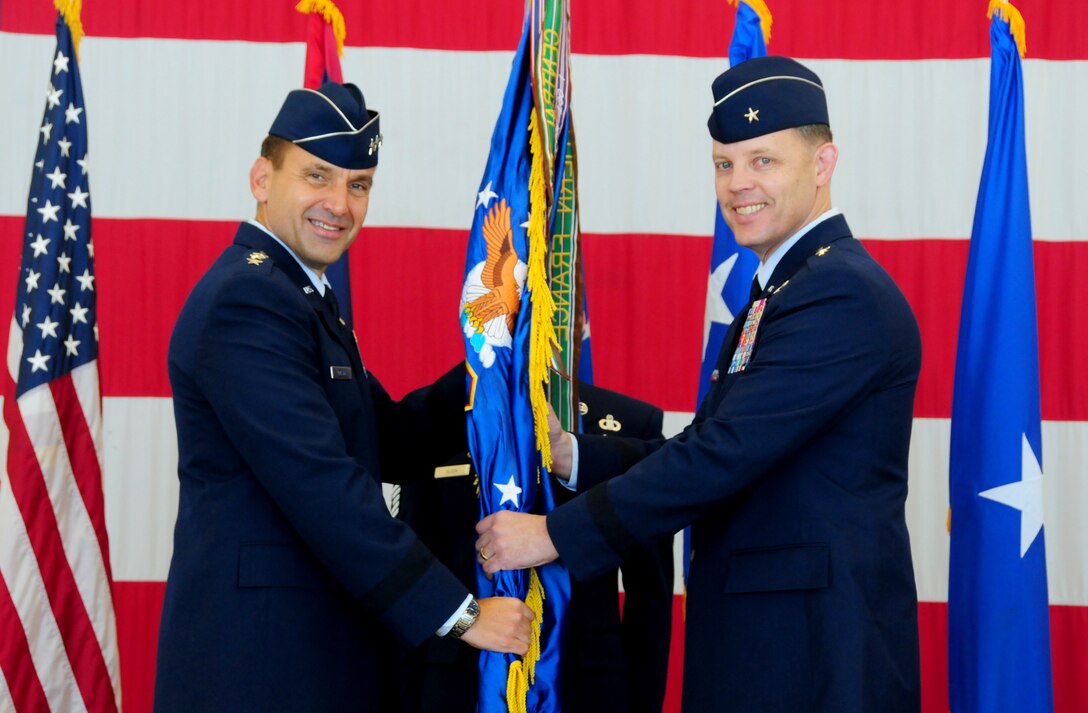 ANDERSEN AIR FORCE BASE, Guam—Lt. Gen. Stanley Kresge, 13th Air Force commander, gives command of the 36th Wing to Brig. Gen. Steven Garland, incoming 36th Wing commander, during the wing’s change of command ceremony, June 26. During the ceremony, General Garland assumed command from the outgoing commander, Brig. Gen. John Doucette. (U.S. Air Force photo by Senior Airman Benjamin Wiseman/Released)