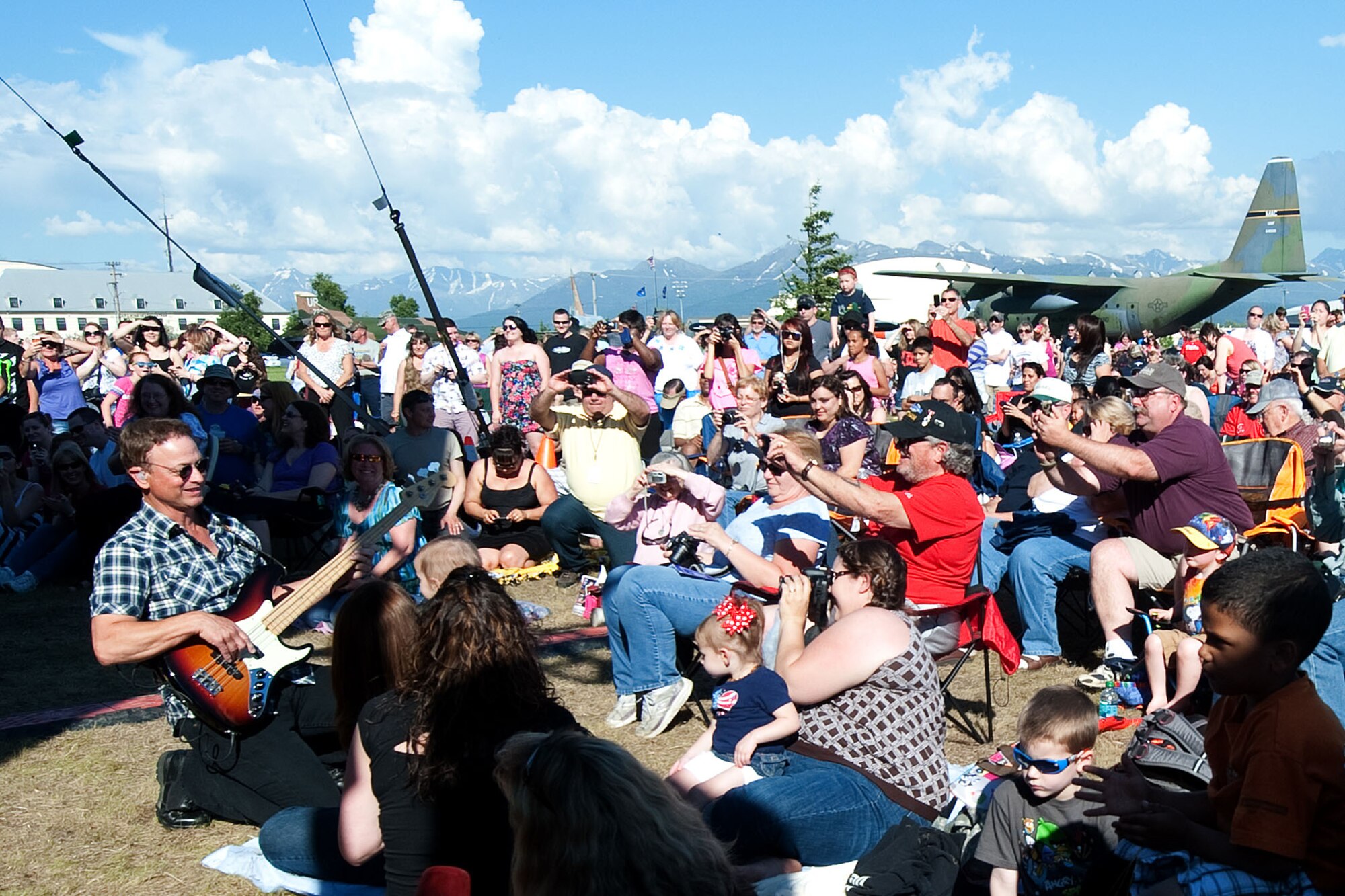 Gary Sinise kicks off the Lt. Dan band's performance by joining the crowd during a concert on Joint Base Elmendorf-Richardson June 22. The band perform regularly for troops in appreciation for their service, and the actor/musician also participates in other charitable events such as parades. Sinise is perhaps best known for his role as Lt. Dan in Forest Gump, and has made appearances in many other films and shows including the currently running CSI: NY. (U.S. Force photo/Staff Sgt. Robert Barnett)