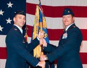 Lt. Col. Daniel Garoutte, right, accepts command of the 33rd Flying Training Squadron at Vance Air Force Base, Okla., from Col. James Abatti, the 71st Operations Group commander, during a ceremony held June 26 in Hangar 170. (U.S. Air Force photo/ Terry Wasson)