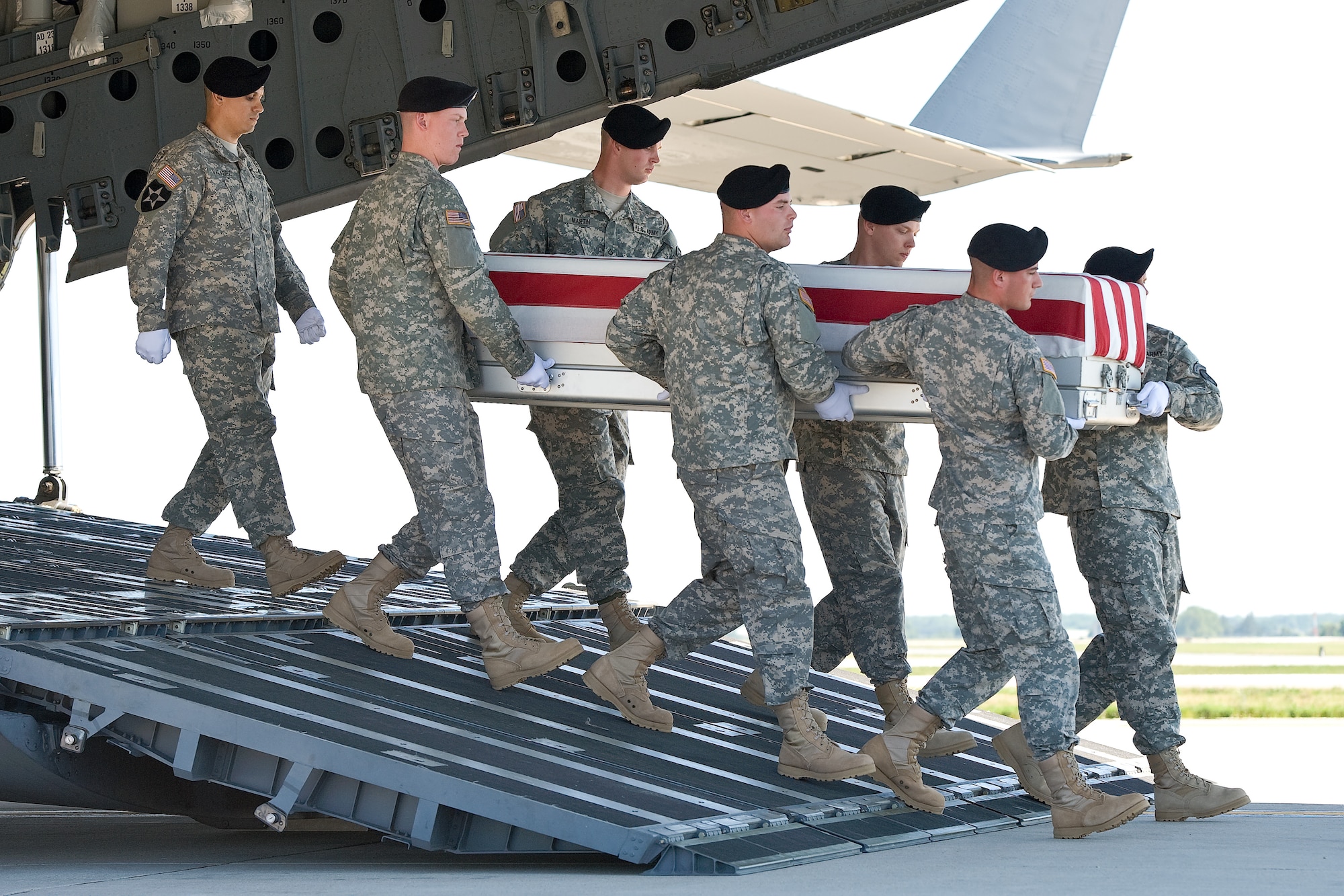 A U.S. Army carry team transfers the remains of Army Sgt. Michael J. Strachota, of White Hall, Ark., at Dover Air Force Base, Del., June 27, 2012. Strachota was assigned to the 96th Transportation Company, 180th Transportation Battalion, 4th Sustainment Brigade, Fort Hood, Texas. (U.S. Air Force photo/Roland Balik)