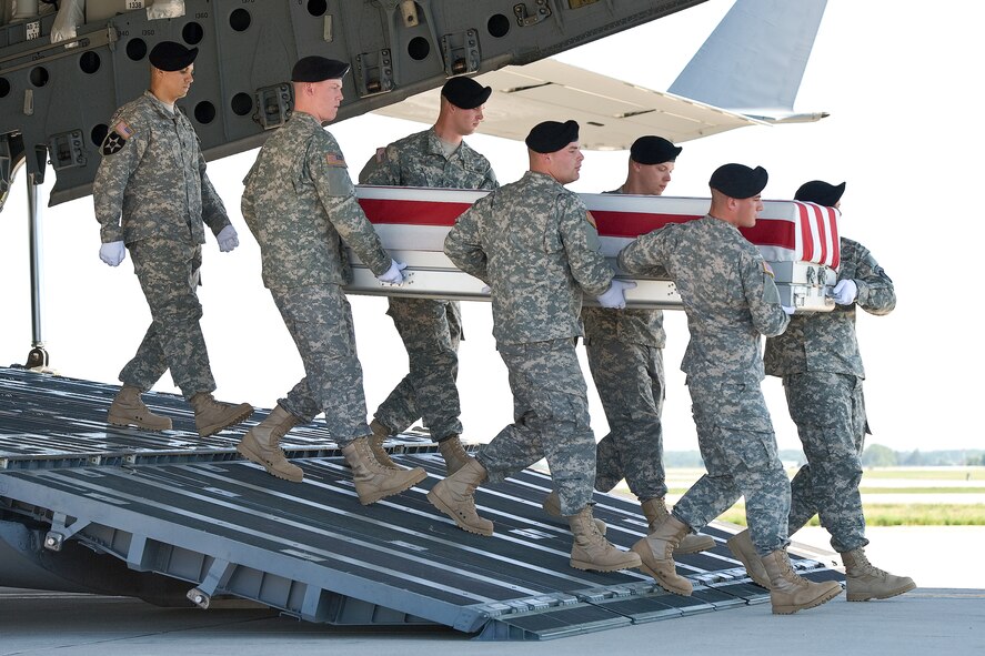 A U.S. Army carry team transfers the remains of Army Sgt. Michael J. Strachota, of White Hall, Ark., at Dover Air Force Base, Del., June 27, 2012. Strachota was assigned to the 96th Transportation Company, 180th Transportation Battalion, 4th Sustainment Brigade, Fort Hood, Texas. (U.S. Air Force photo/Roland Balik)