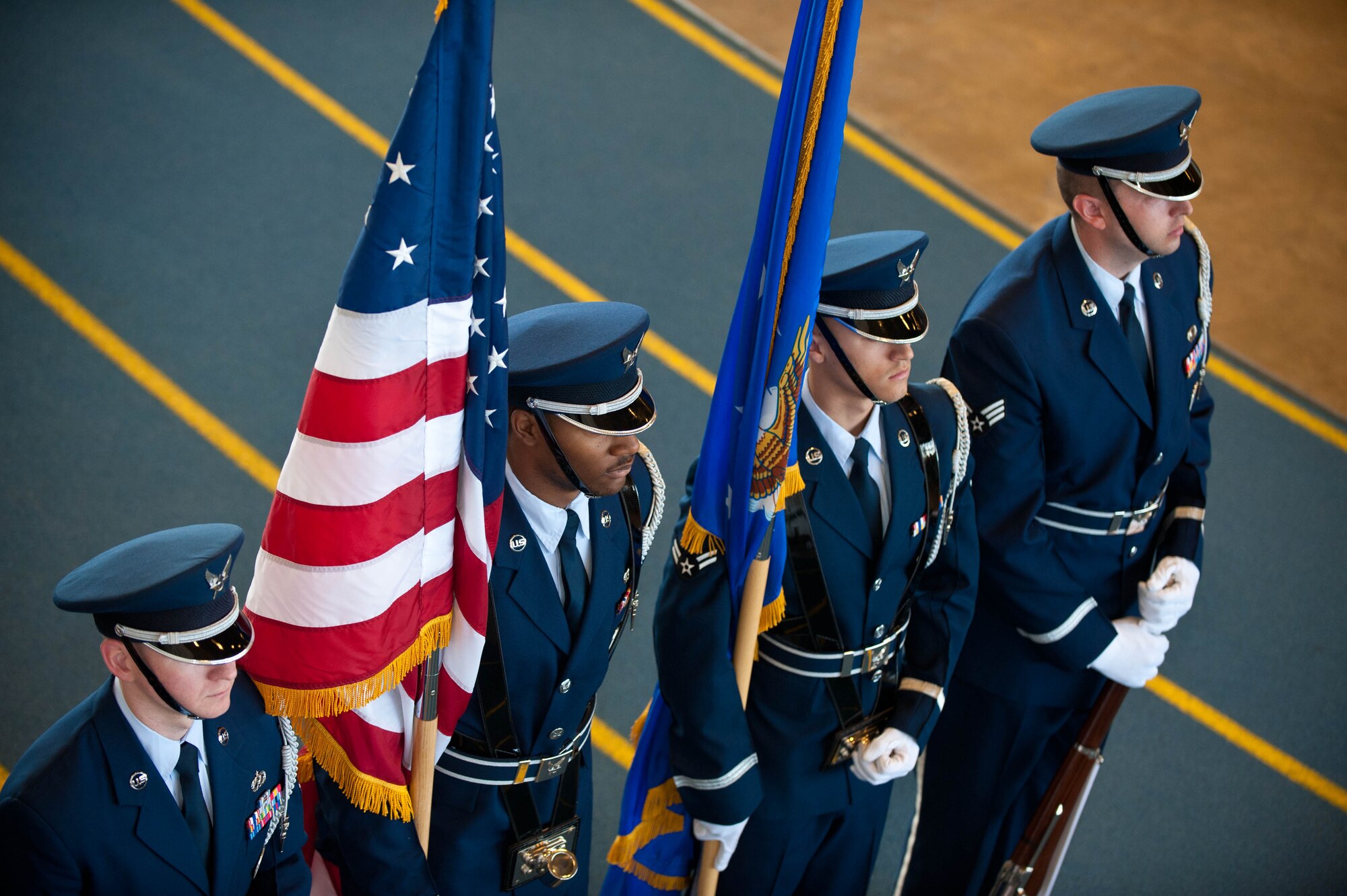 Ellsworth Honor Guard members stand ready to present the colors during a change of command ceremony for the 28th Maintenance Operations Squadron in the Pride Hangar at Ellsworth Air Force Base, S.D., June 22, 2012. The base Honor Guard is responsible for providing military honors throughout a 114,636 square mile area covering South Dakota, western Nebraska and northern Wyoming. (U.S. Air Force photo by Airman 1st Class Zachary Hada, Released)