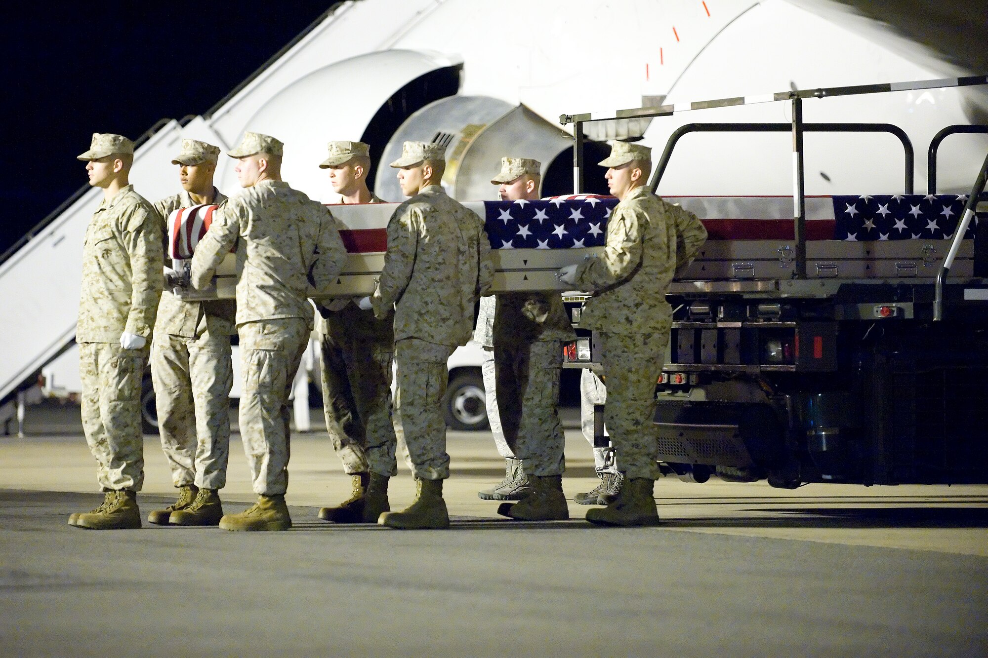A U.S. Marine Corps carry team transfers the remains of Marine Lance Cpl. Hunter D. Hogan of Norman, Ind., at Dover Air Force Base, Del., June 27, 2012. Hogan was assigned to 1st Battalion, 8th Marine Regiment, 2nd Marine Division, II Marine Expeditionary Force, Camp Lejeune, N.C. (U.S. Air Force photo/Adrian R. Rowan)