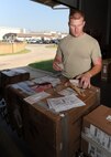 Senior Airman Kyle Trapp, 22nd Logistics Readiness Squadron cargo movement journeyman, checks the integrity of opened packages to ensure correct shipment June 27, 2012, McConnell Air Force Base, Kan. As an outbound cargo movement technician, Trapp monitors movement of processed assets by utilizing the Enterprise Solution Supply system and ensures proper packaging, handling and certification of hazardous cargo. He was selected as the 22nd Air Refueling Wing Spotlight performer for the week of June 25 to June 29, 2012. (U.S. Air Force photo/Airman 1st Class Laura L. Valentine)
