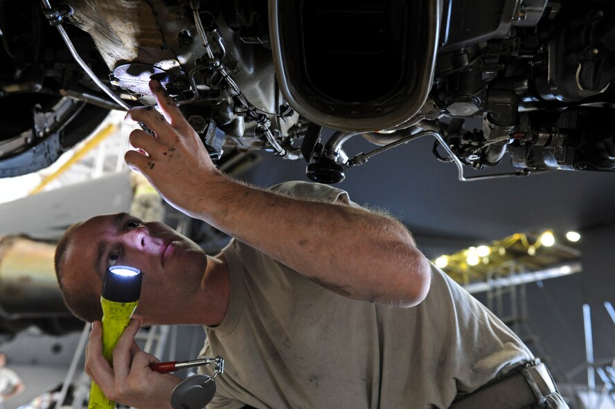 Airman 1st Class Corey Cutright, 2nd Aircraft Maintenance Squadron, inspects an engine of a B-52H Stratofortess bomber on Barksdale Air Force Base, La., June 27. Once a B-52 has accumulated 450 flight hours, the aircraft is removed from the flightline and brought into a hangar for preventative maintenance. Maintenance Airmen inspect the aircraft from nose to tail, wing tip to wing tip fixing any discrepancies they find along the way. (U.S. Air Force photo Airman 1st Class Micaiah Anthony)(RELEASED)