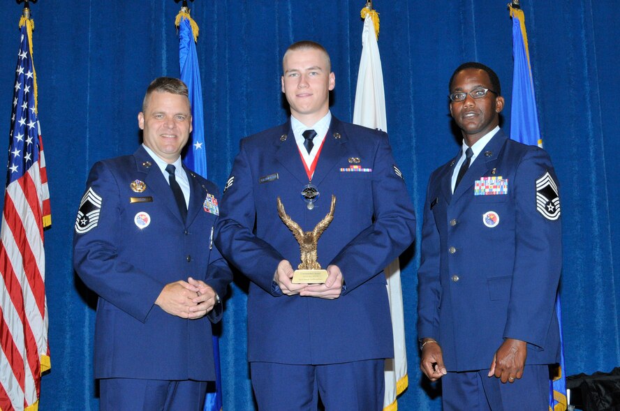 McGHEE TYSON AIR NATIONAL GUARD BASE, Tenn. - Senior Airman Derek Gulbrandson, center, receives the Paul H. Lankford commandant award for Airman Leadership School Class 12-4 at the I.G. Brown Training and Education Center from Chief Master Sgt. Donald Felch, left, and Chief Master Sgt. Lawrence W. Kirby, June 7, 2012.  The leadership award is presented to the student who made the most significant contribution to the overall success of the class by demonstrating superior leadership abilities and excellent skills as a team member.  It is named in honor of CMSgt Paul H. Lankford, a Bataan Death March survivor and the first commandant of the Air National Guard Enlisted Professional Military Education Center.  (Air National Guardphoto by Master Sgt. Kurt Skoglund/Released)