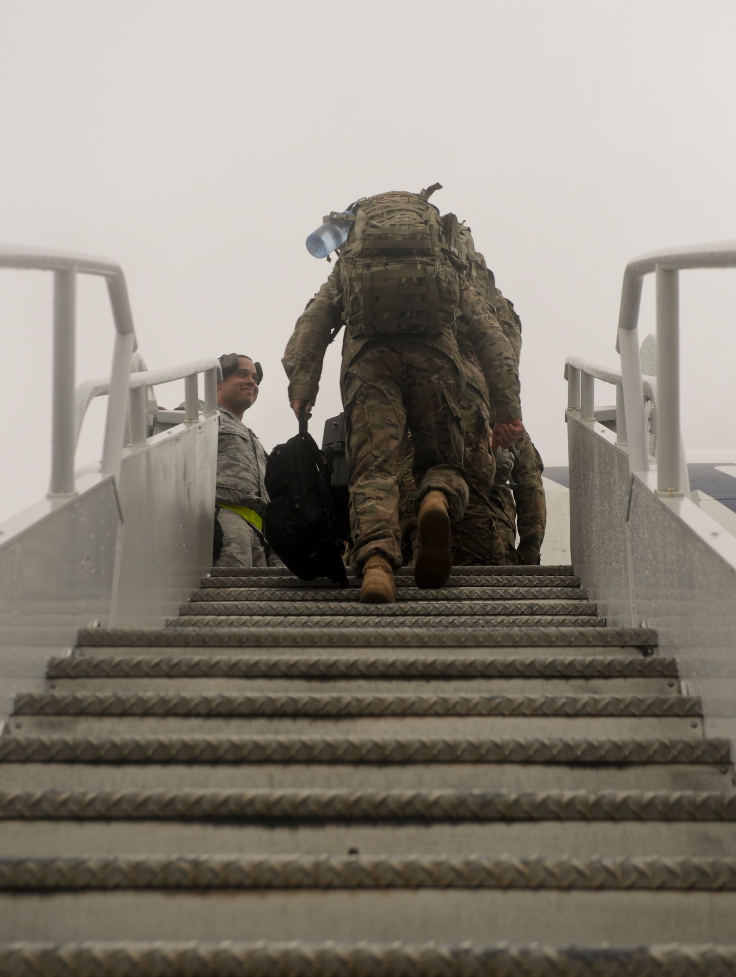 The last of 824th Base Defense Squadron Airmen board a plane before a deployment at Moody Air Force Base, Ga., June 24, 2012. The Airmen will support a six-month deployment to Afghanistan. (U.S. Air Force photo by Senior Airman Nicholas Benroth/Released)