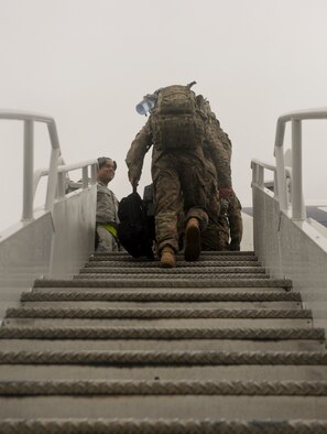 The last of 824th Base Defense Squadron Airmen board a plane before a deployment at Moody Air Force Base, Ga., June 24, 2012. The Airmen will support a six-month deployment to Afghanistan. (U.S. Air Force photo by Senior Airman Nicholas Benroth/Released)
