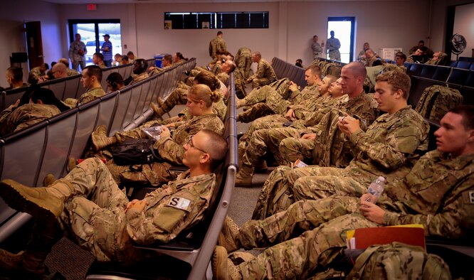 Members of the 824th Base Defense Squadron gather and prepare to depart for their deployment to Afghanistan, at Moody Air Force Base, Ga., June 24, 2012. This was the first of two groups from the 824th BDS that will support operations overseas for six months. (U.S. Air Force photo by Senior Airman Nicholas Benroth/Released)  