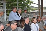 Brig. Gen. Theresa Carter (right top), Joint Base San Antonio commander, and 14 honorary commanders  watch a 802nd Security Forces military working dog demonstration at Joint Base San Antonio-Lackland, Texas, June 20. (U.S. Air Force photo by Alan Boedeker)