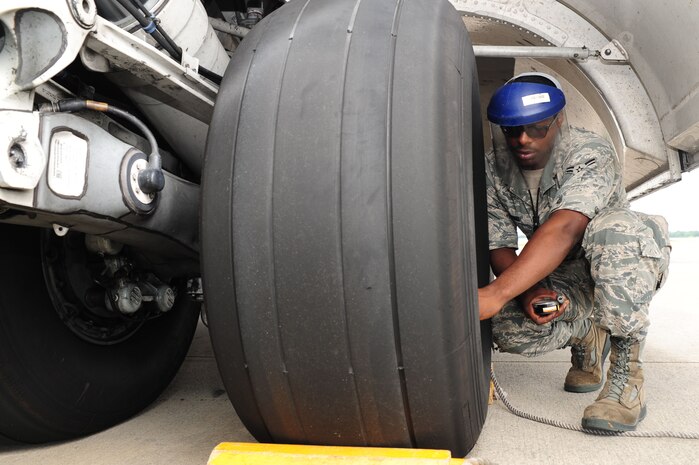 Airman 1st Class Devin Lorenzi, 437th Aircraft Maintenance Squadron from Joint Base Charleston, S.C., checks the tire pressure on a C-17 Globemaster III, June 22, 2012. JB Charleston has 54 C-17’s. The 437th AMXS Aerospace technicians perform inspections on the aircraft to ensure they are ready for any mission. (U.S. Air Force photo/ Airman 1st Class Chacarra Walker)