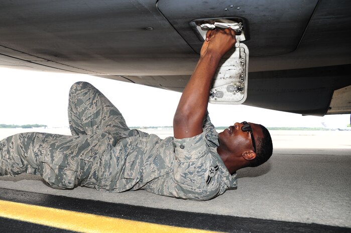 Airman 1st Class Devin Lorenzi, 437th Aircraft Maintenance Squadron from Joint Base Charleston, S.C., replaces a lower hatch seal on a C-17 Globemaster III, June 22, 2012. JB Charleston has 54 C-17’s. The 437th AMXS Aerospace technicians perform inspections on the aircraft to ensure they are ready for any mission. (U.S. Air Force photo/ Airman 1st Class Chacarra Walker)