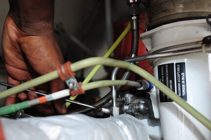 Airman 1st Class Devin Lorenzi, 437th Aircraft Maintenance Squadron Aerospace Maintenance journeyman from Joint Base Charleston, S.C., tightens a screw in the air conditioning unit on a C-17 Globemaster III, June 22, 2012. JB Charleston has 54 C-17’s. The 437th AMXS Aerospace technicians perform inspections on the aircraft to ensure they are ready for any mission. (U.S. Air Force photo/ Airman 1st Class Chacarra Walker)