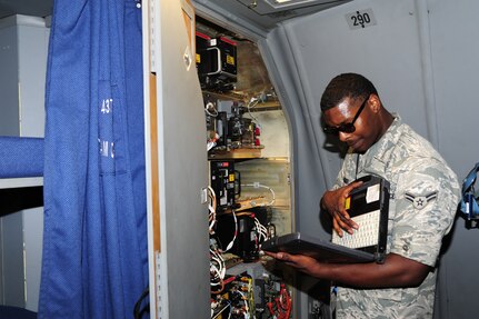 Airman 1st Class Devin Lorenzi, 437th Aircraft Maintenance Squadron Aerospace Maintenance journeyman from Joint Base Charleston, S.C., logs into a computer to check operating instructions on board a C-17 Globermaster III, June 22, 2012. JB Charleston has 54 C-17’s. The 437th AMXS Aerospace technicians perform inspections on the aircraft to ensure they are ready for any mission. (U.S. Air Force photo/ Airman 1st Class Chacarra Walker) 