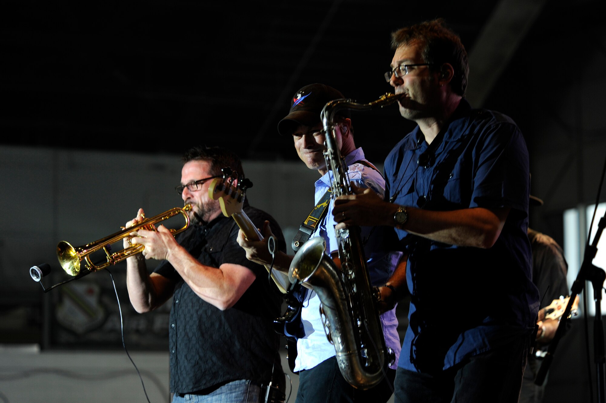 Gary Sinise and Lt. Dan Band perform for service members and their families June 23, 2012, Eielson Air Force Base, Alaska. Last year, the band put on 16 USO performances at 16 bases, entertaining and lifting the spirits of more than 61,000 troops and military families. (U.S. Air Force photo/ Staff Sgt. Jim Araos)