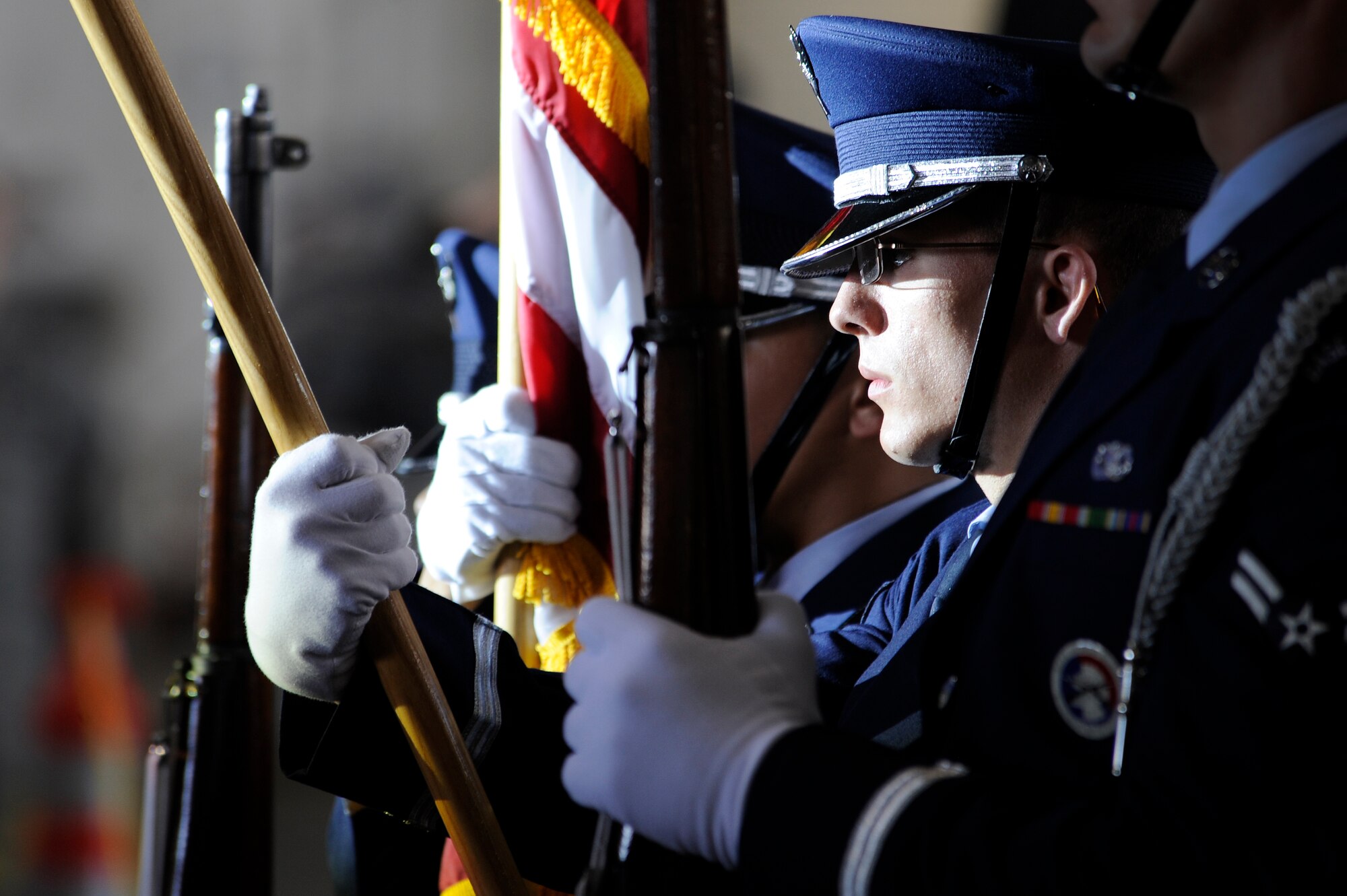 U.S. Air Force Airman 1st Class Justin Goodwin, Eielson Air Force Base honor guardsman, presents the colors during the opening of the Gary Sinise and Lt. Dan Band concert June 23, 2012, Eielson AFB, Alaska. (U.S. Air Force photo/ Staff Sgt. Jim Araos)