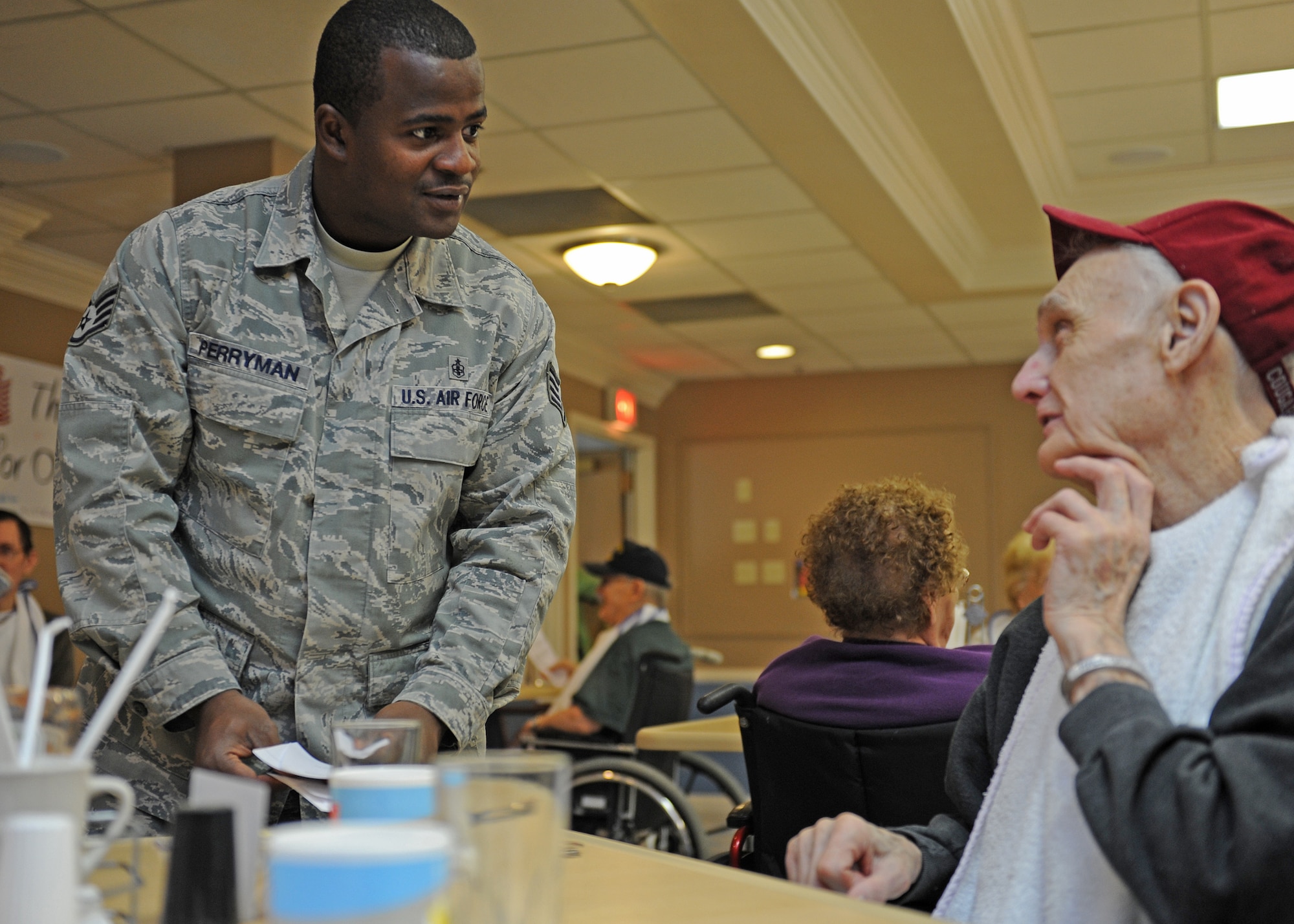 Staff Sgt. Robert Perryman, 336th Training Support Squadron, takes a meal order at the Spokane Veterans Home in Spokane, Wash., June 20, 2012. Airmen from Fairchild Air Force Base took time out of their day to serve the veterans lunch and spend time with them. (U.S. Air Force photo by Staff Sgt. Michael Means/Released)