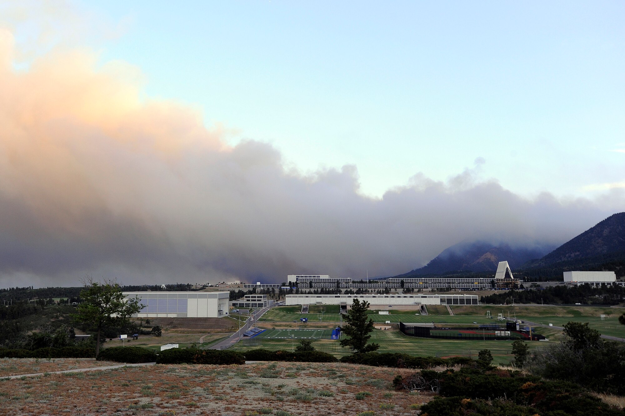 The Waldo Canyon fire burns off the southern border of the U.S. Air Force Academy in Colorado Springs, Colo., June 26, 2012. Mandatory evacuations have been ordered for all housing residents on the Air Force Academy as this fire continues to spread. (U.S. Air Force photo/Mike Kaplan)