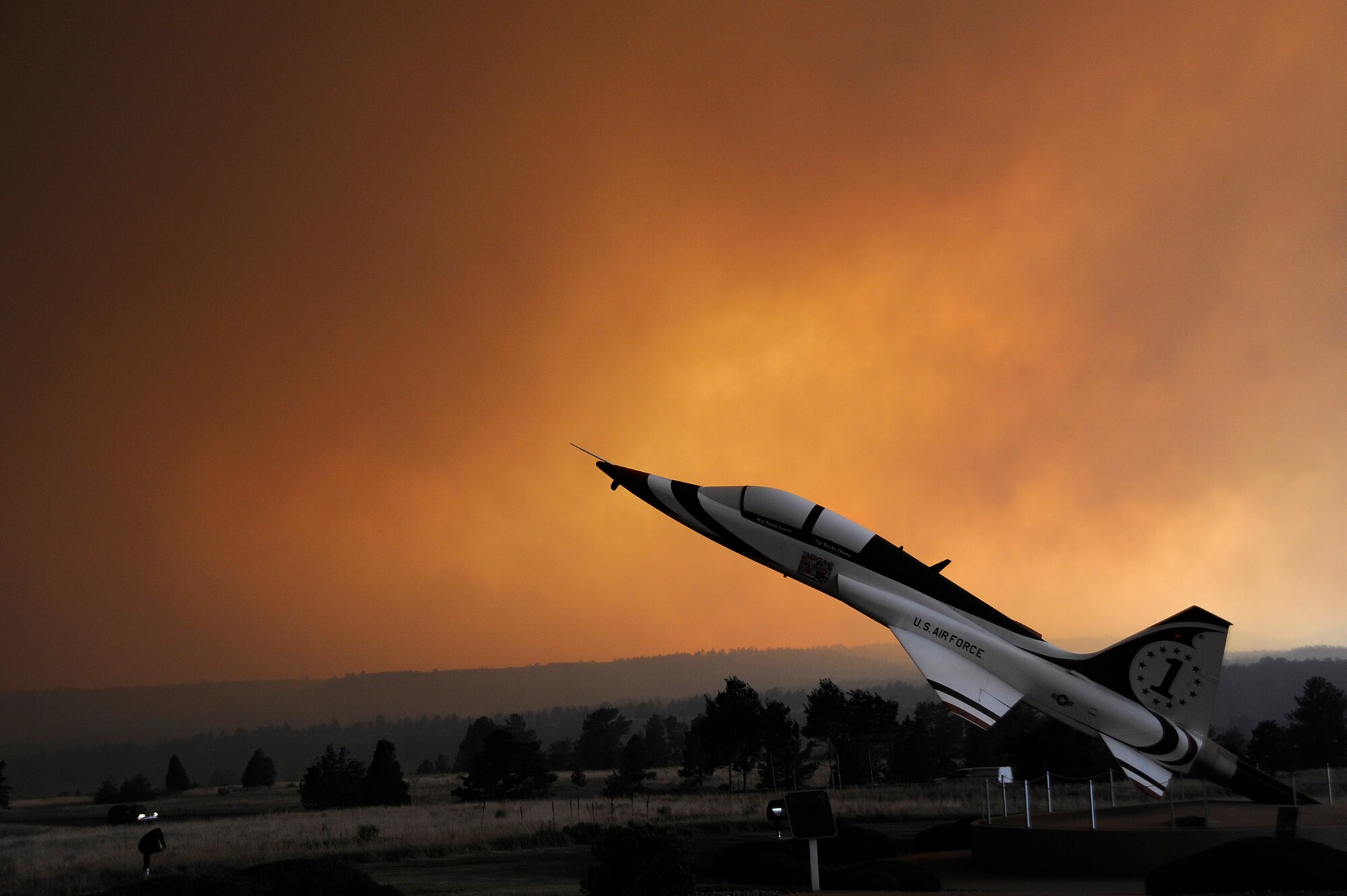 A rapidly spreading smoke cloud surrounds the U.S. Air Force Academy's T-38 in Colorado Springs, Colo., June 26, 2012. The Waldo Canyon fire is burning in the area of the Air Force Academy. (U.S. Air Force Photo/ Mike Kaplan)