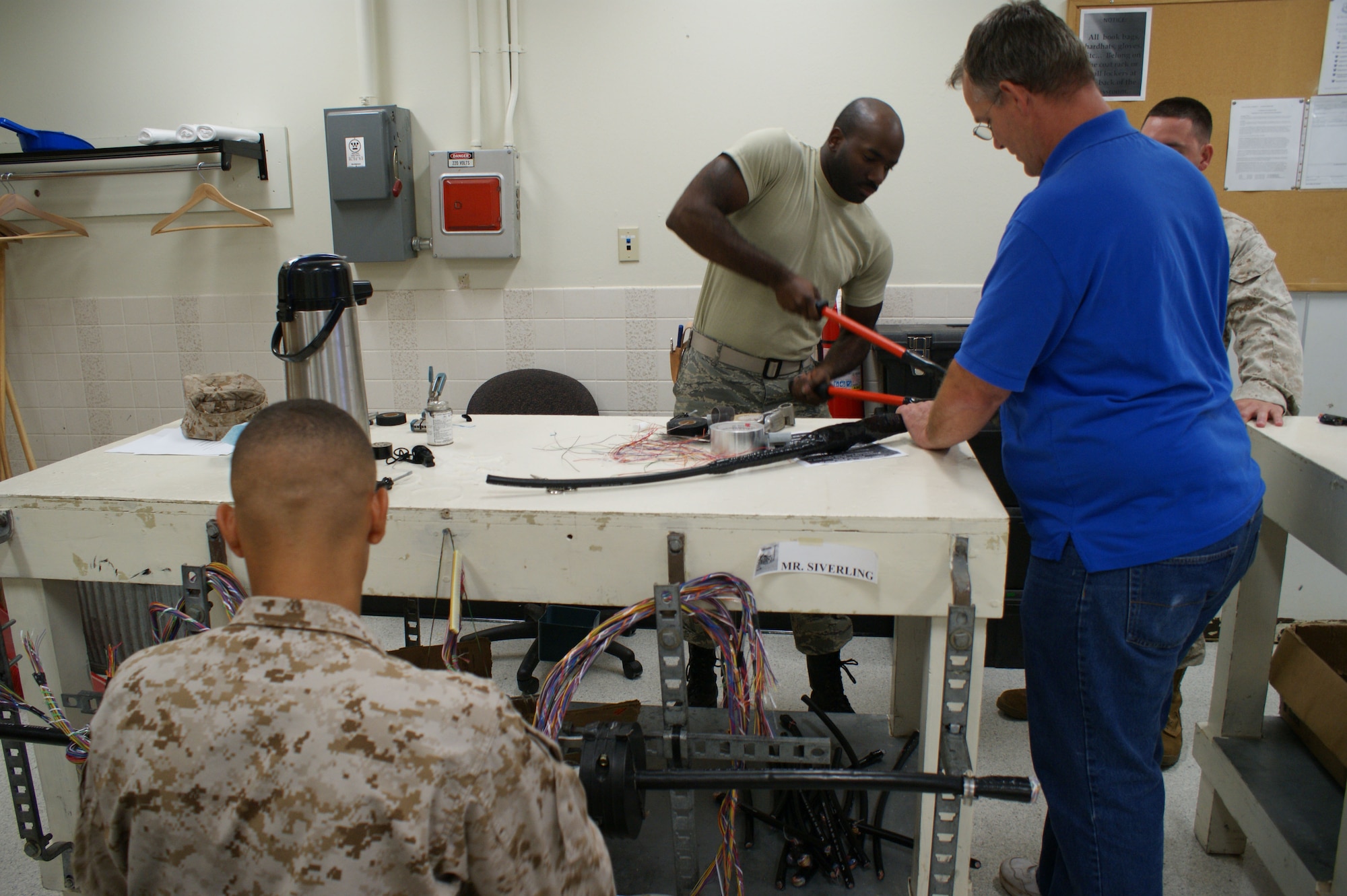 Students in the 364th Training Squadron work on antenna cable during the Communications Cable and Antenna Systems apprentice course Jun 26, 2012 at Sheppard Air Force Base, Texas.   The course graduates approximately 60 USMC students annually, along with approximately 290 students from the Air Force and Army.  (U.S. Air Force photo/Dan Hawkins)