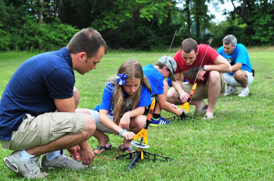 Children launch rockets during the final day of the Science and Technology Academies Reinforcing Basic Aviation and Space Exploration Program at Greenwood Middle School in Goldsboro, N.C., June 22, 2012. The rising fifth graders who participated in the program spent their mornings in a classroom studying topics like Bernoulli's principles of flight and Newton's laws of motion. In the afternoon, they traveled to Seymour Johnson Air Force Base to see the topics they learned in action. (U.S. Air Force photo/Tech. Sgt. Tammie Moore/Released)