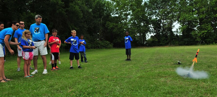 Children launch rockets during the final day of the Science and Technology Academies Reinforcing Basic Aviation and Space Exploration Program at Greenwood Middle School in Goldsboro, N.C., June 22, 2012. The rising fifth graders who participated in the program spent their mornings in a classroom studying topics like Bernoulli's principles of flight and Newton's laws of motion. In the afternoon, they traveled to Seymour Johnson Air Force Base to see the topics they learned in action. (U.S. Air Force photo/Tech. Sgt. Tammie Moore/Released)