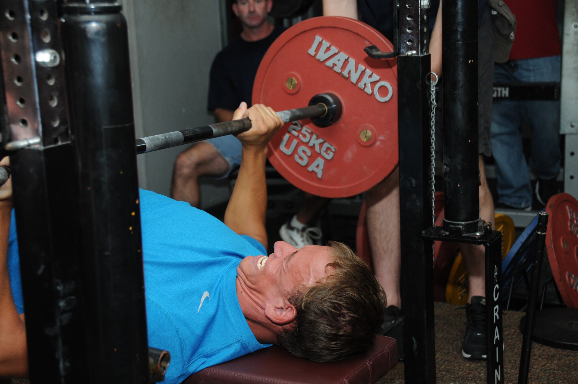 Patrick Charters, spouse of Airman Basic Carrie Charters, 336th Training Squadron, attempts to  bench press 192 pounds in his first attempt in the category at the American Powerlifting Federation event at the Triangle Fitness Center June 22, 2012, Keesler Air Force Base, Miss.  Fifteen participants completed squats, bench presses and dead lifts in four categories — open raw division, equipped division, masters division and women division.  (U.S. Air Force photo by Kemberly Groue)