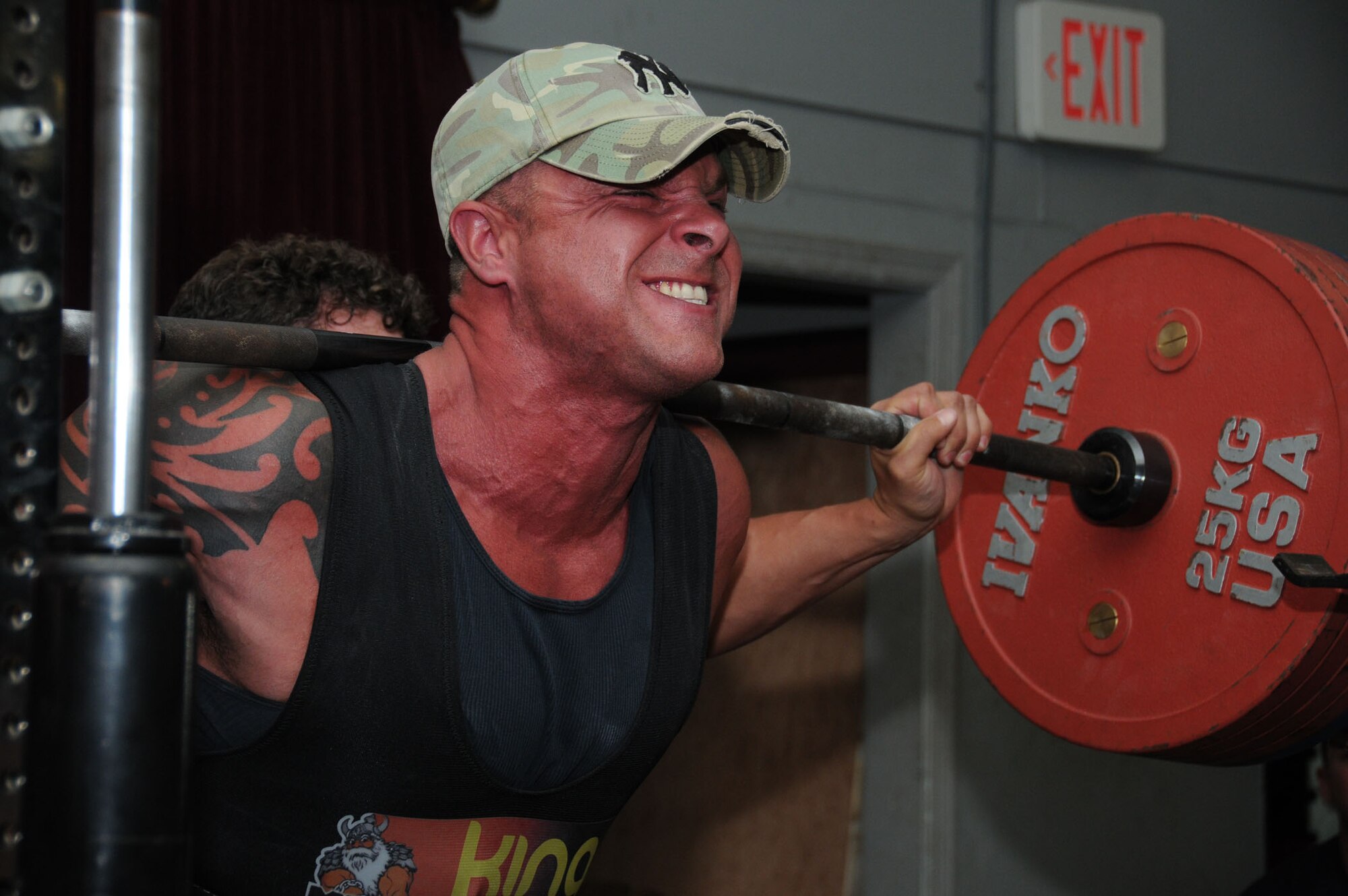 Tech. Sgt. Kasey Crowe, 334th Training Squadron, squats 475 pounds successfully for his first attempt in the category at the American Powerlifting Federation event at the Triangle Fitness Center June 22, 2012, Keesler Air Force Base, Miss.  Fifteen participants completed squats, bench presses and dead lifts in four categories — open raw division, equipped division, masters division and women division.  Crowe placed best overall in the male equipped division.  (U.S. Air Force photo by Kemberly Groue)