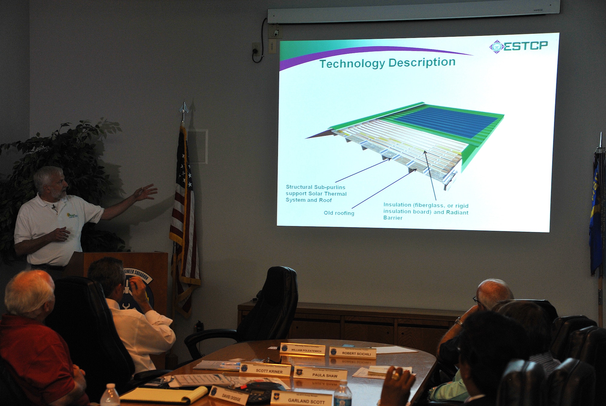 GOODFELLOW AIR FORCE BASE, Texas-- William Poleatewich, Director of Technologies at Pfister Energy, discusses the inner workings of the new 17th Security Forces Squadron High-Performance Energy-Efficient Cool Metal Roof June 27. The new roof produces solar energy to the building and also helps to collect rain water. (U.S. Air Force photo/Airman 1st Class Michael Smith) 