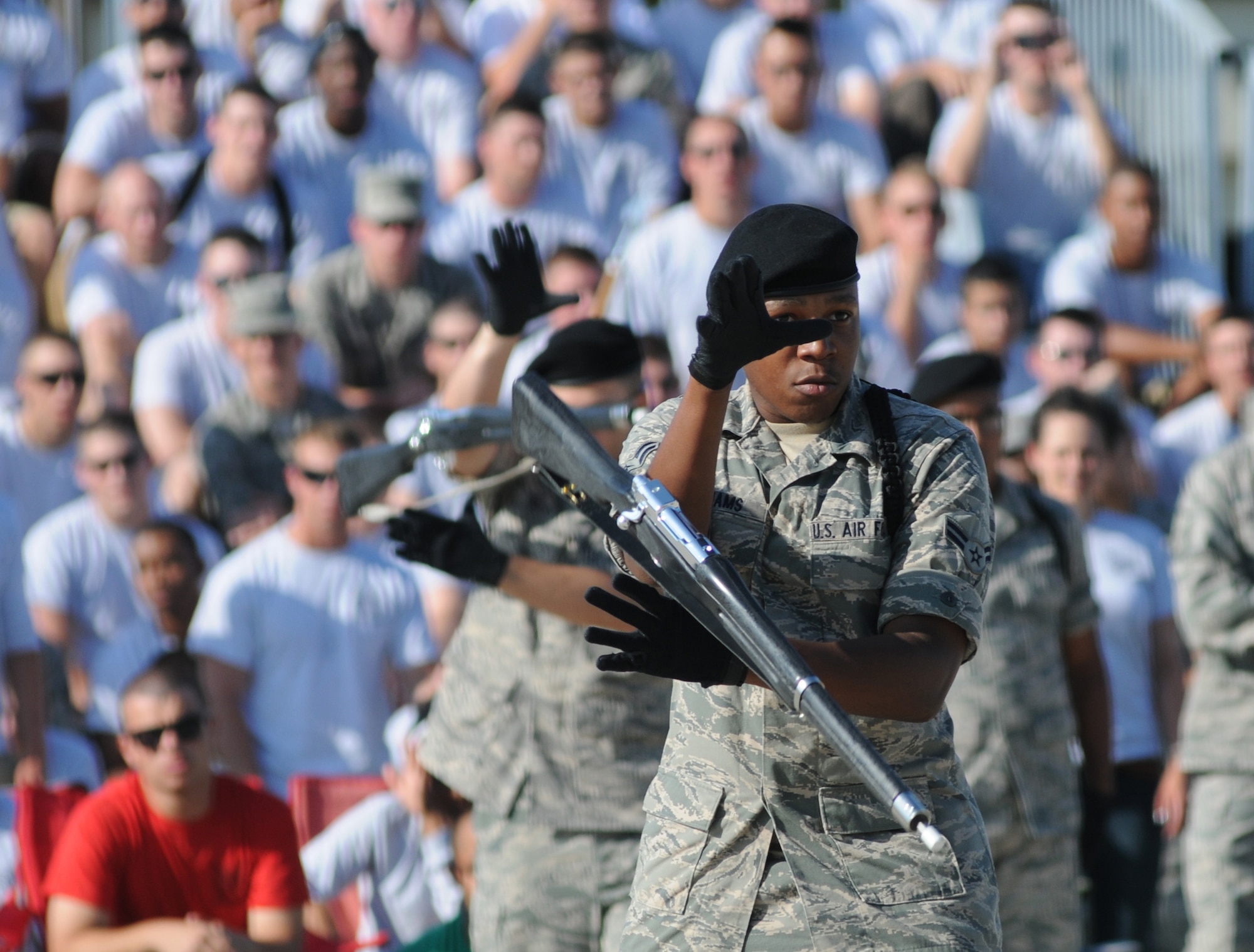Airman 1st Class Eric Williams, 338th Training Squadron drill team instructor, spins his weapon during the freestyle portion of the drill down competition June 22, 2012, at Keesler Air Force Base Miss. The Dark Knights placed 1st overall, 2nd in both open ranks and regulation and 3rd in freestyle drill.  (U.S. Air Force photo by Kemberly Groue)