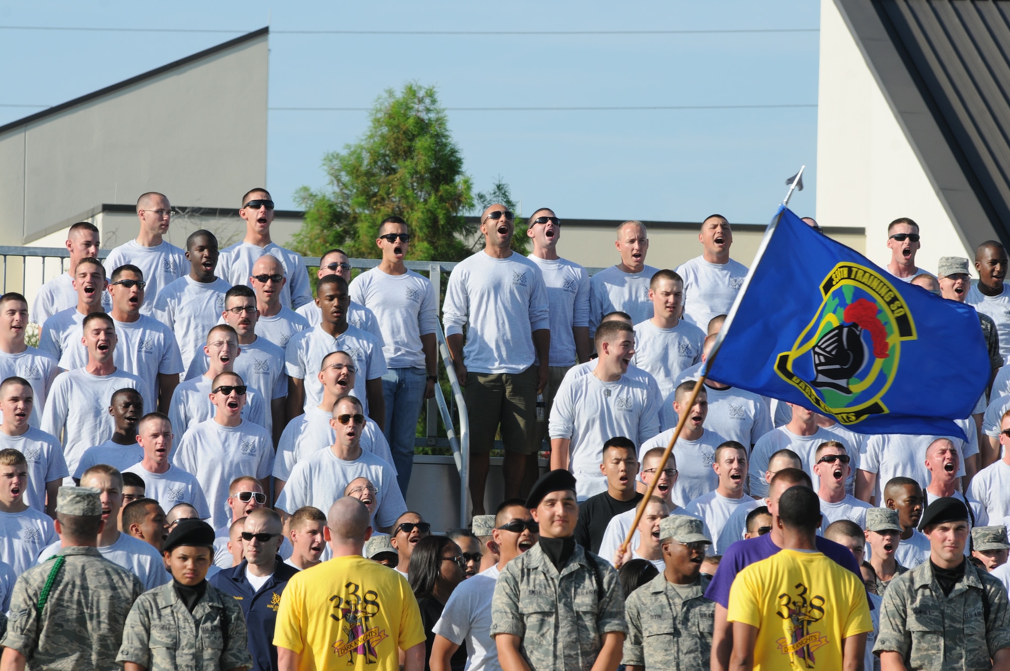 Members of the 338th Training Squadron yell out their squadron chant prior to the start of the drill down competition June 22, 2012, at Keesler Air Force Base Miss. The Dark Knights placed 1st overall, 2nd in both open ranks and regulation and 3rd in freestyle drill.  (U.S. Air Force photo by Kemberly Groue)