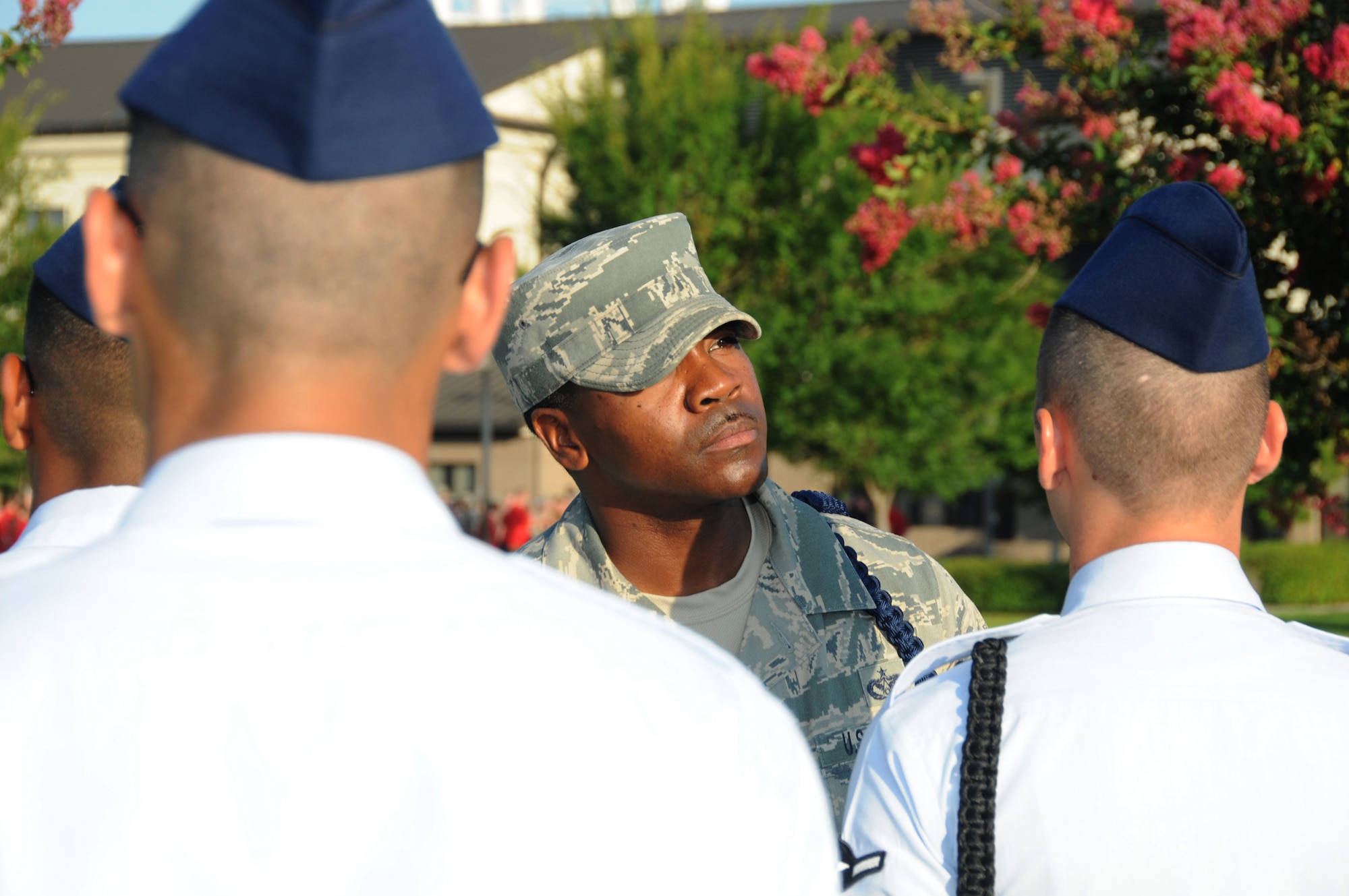 Tech Sgt. Terrance Boyd, 81st Training Group, conducts an open ranks inspection on members of the 338th drill team during a drill down competition June 22, 2012, at Keesler Air Force Base Miss.  The Dark Knights placed 1st overall, 2nd in both open ranks and regulation and 3rd in freestyle drill competition.  (U.S. Air Force photo by Kemberly Groue)