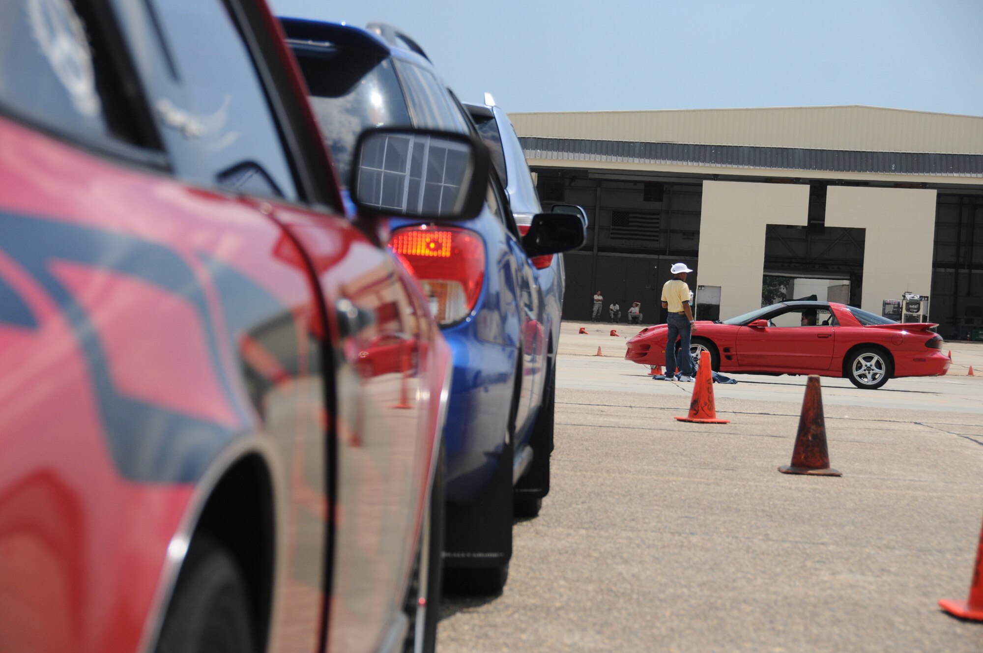 Students line up to take their vehicles through the  street survival and defensive driving course on the flight line June 23, 2012, at Keesler Air Force Base, Miss.  The students spent the first few hours receiving briefings and the rest of the two-day course was dedicated to hands-on practice on the flight line.  (U.S. Air Force photo by Kemberly Groue)